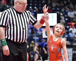 Jeff Lange | The Vindicator  Jake Hughes of Beaver Local has his arm raised in victory after defeating his Massillon Perry opponent Brennan Warwick 3-0 in their 55.1 lb championship bout during the OAC Grade School State Wrestling Tournament held at the Covelli Centre, Sunday, March 29, 2015.