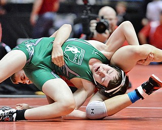 Jeff Lange | The Vindicator  Beaver Local's Brenden Severs (green) gets tangled up with Jake Niffenegger of Palmer Wrestling Club during their battle for first place in the 100.4 lb class during the OAC Grade School State Wrestling Tournament held in Youngstown, Sunday, March 29, 2015.