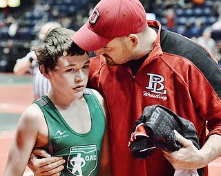 Jeff Lange | The Vindicator  Beaver Local's Brenden Severs (left) is congratulated by his father Rick after defeating his opponent Jake Niffenegger of Palmer in their 100.4 lb match during the OAC Grade School State Wrestling Tournament in Youngstown, Sunday, March 29, 2015.