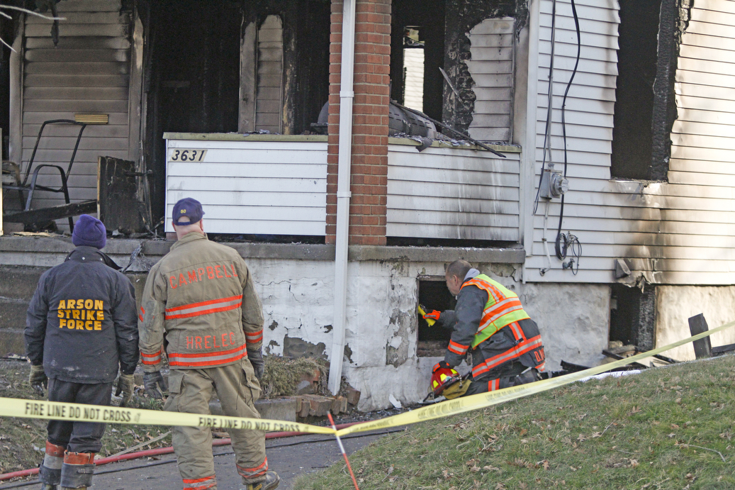        ROBERT K. YOSAY  | THE VINDICATOR..YFD, Mahoning Valley Arson Task Force, YPD detectives and State Fire Marshalls office as they investigated a fatal fire that killed Two grandparents and their 11 year old grandaughter.