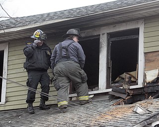        ROBERT K. YOSAY  | THE VINDICATOR..YFD, Mahoning Valley Arson Task Force, YPD detectives and State Fire Marshalls office as they investigated a fatal fire that killed Two grandparents and their 11 year old grandaughter.