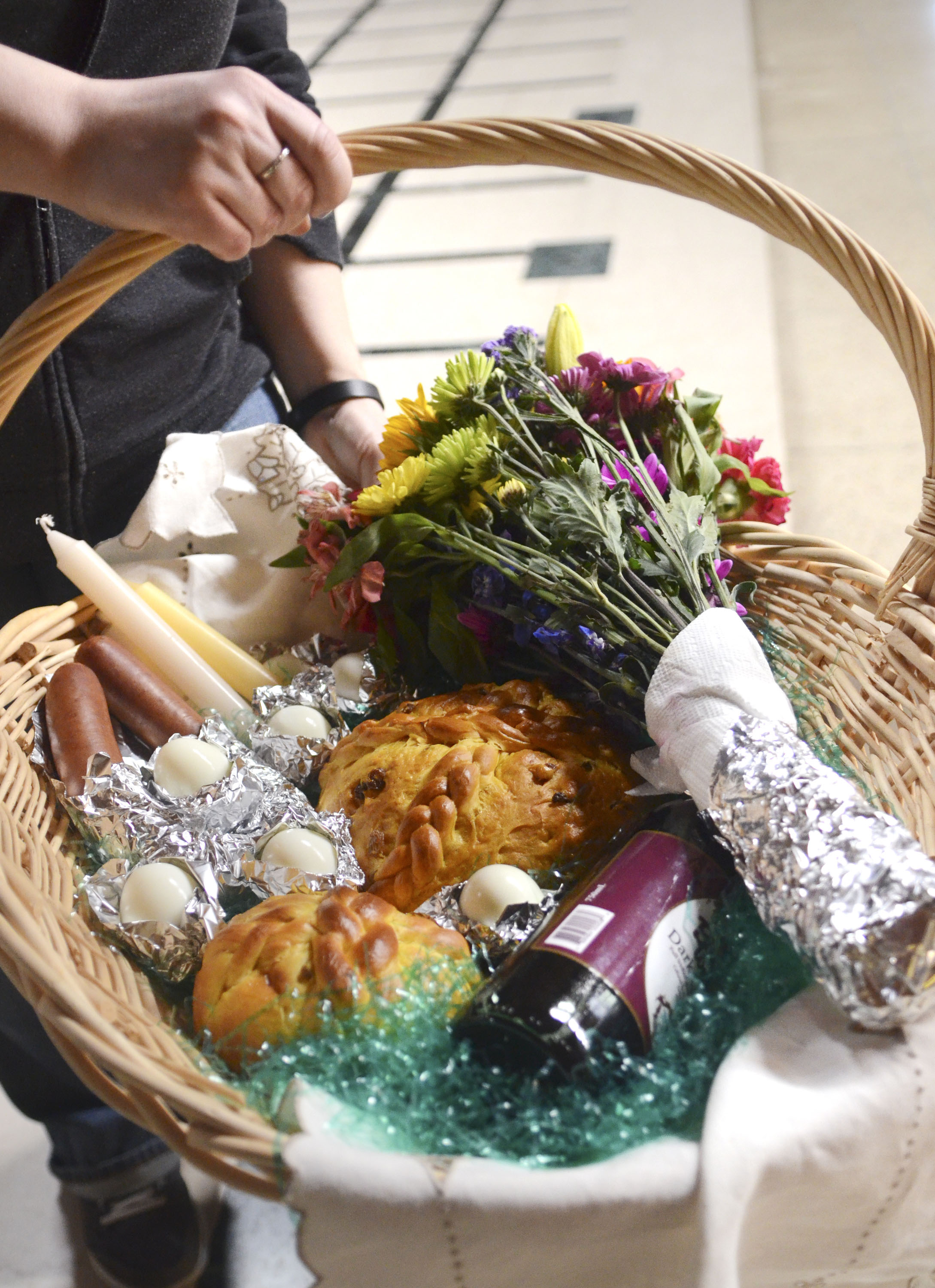Katie Rickman | The Vindicator.An Easter basket filled with food and other items that will be used the next day for an Easter meal is one of the many baskets blessed during the Easter Basket Blessing Ceremony at St. Patricks Church in Hubbard on April 4, 2015.