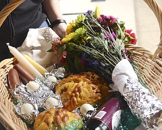 Katie Rickman | The Vindicator.An Easter basket filled with food and other items that will be used the next day for an Easter meal is one of the many baskets blessed during the Easter Basket Blessing Ceremony at St. Patricks Church in Hubbard on April 4, 2015.