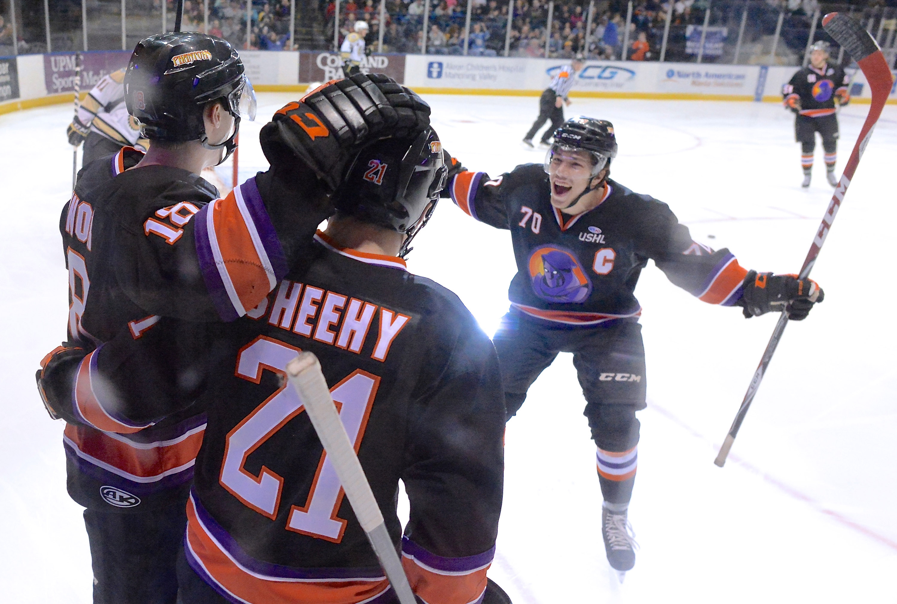 Jeff Lange | The Vindicator  APRIL 4, 2015 - Phantoms' Ryan Lomberg (70) rushes to his teammates Kyle Connor (18) and Tyler Sheehy (21) after a first-period goal in Saturday night's hockey game at the Covelli Centre.