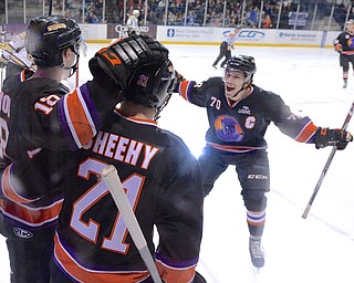 Jeff Lange | The Vindicator  APRIL 4, 2015 - Phantoms' Ryan Lomberg (70) rushes to his teammates Kyle Connor (18) and Tyler Sheehy (21) after a first-period goal in Saturday night's hockey game at the Covelli Centre.