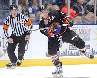 Jeff Lange | The Vindicator  APRIL 4, 2015 - Youngstown's Connor McDonald stares down the puck as he smacks it towards the goal in the first period of the Phantoms' game against the Muskegon Lumberjacks, Saturday night at the Covelli Centre.