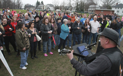 William D Lewis The vindicator Eddie Berg of Yougstown plays a song he wrote about fire victim Corinne Gump duirng a Tuesday vigil for Corrine and her grandparents who were killed in a house fire on Powersway. Several hundred people attended the event.