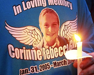 William D Lewis The vindicator Vigil held for those killed in house fire.