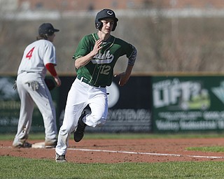 ask reporter or Bob Yosay for the player's name..04-10-15 BASEBALL Girard Indians vs Ursuline Irish at Cene Park in Struthers, OH..1st inning, Ursuline's #12  rounds 3rd to score.