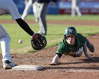 ask reporter or Bob Yosay for the player's name..04-10-15 BASEBALL Girard Indians vs Ursuline Irish at Cene Park in Struthers, OH..4th inning, on a pickoff attempt, Ursuline's #22  dives safely into 1st base