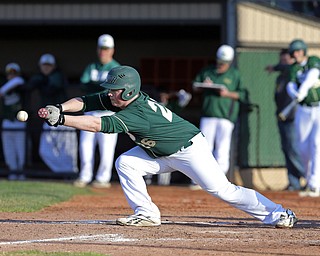 ask reporter or Bob Yosay for the player's name..04-10-15 BASEBALL Girard Indians vs Ursuline Irish at Cene Park in Struthers, OH..5th inning, Ursuline's #26  executes the bunt to adavnce the runners.