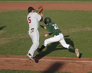       .         ROBERT  K. YOSAY | THE VINDICATOR..Girard @ Ursuline at Cene Park.. ..Girards #5 Bello jumps up to get the ball to tag out #22 Vito Petrillo  in a 6th inning run down after a long lead off and he fell....-30-