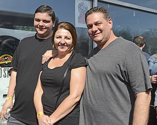 Katie Rickman | The Vindicator .The Francion family (L-R) Anthony (son) Andre and Lisa stand in line at the Pine Tree Place Shopping Center in Niles while waiting for the doors to open for the Foo Fighters Concert.  The Foo Fighters performed in honor of National Record Store Day.