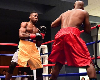 CAMPBELL, OHIO - APRIL 18, 2015: Victor Toney looks for an opening to throw a punch at Dion Meadows during a 153b bout Saturday night. (Photo by David Dermer/Youngstown Vindicator)