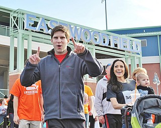 Jeff Lange | The Vindicator  APRIL 18, 2015 - Brian Giangiordano (left) poses for a photo as Adrienne Giangiordano looks on from the right while they walk in the MS walk held at Eastwood Field in Niles.