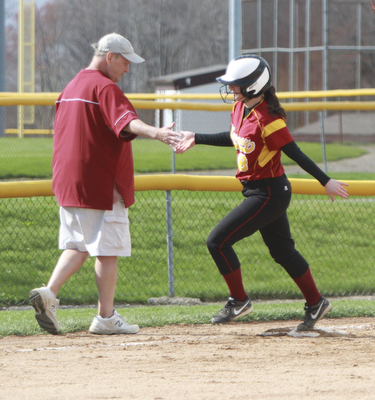 William d Lewis The Vindicator Mooney's Bridget Sweeney(8) gets congrats from coach Mark Rinehart after hitting 1 of her 2 HR's during 4-21 game with East.