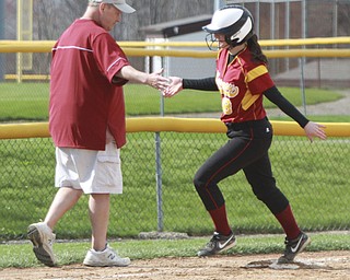 William d Lewis The Vindicator Mooney's Bridget Sweeney(8) gets congrats from coach Mark Rinehart after hitting 1 of her 2 HR's during 4-21 game with East.