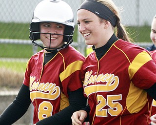 William d Lewis The Vindicator Mooney's Bridget Sweeney(8) gets congrats from Julie cook (25) after hitting her 2nd HR during 4-21 game with East at Field of Dreams.