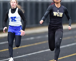 POLAND, OHIO - APRIl 25, 2015: Justice Richardson of Harding sprints to the finish line ahead of Antonella LaMonica JFK during the Girls 100 Meter Dash final Saturday afternoon at Poland High School during the  Poland Invitational Track & Field Meet. (Photo by David Dermer/Youngstown Vindicator)