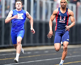 POLAND, OHIO - APRIl 25, 2015: Joe Harrington of Fitch sprints to the finish line ahead of Jacob Coates of JFK during the Boys 100 Meter Dash final Saturday afternoon at Poland High School during the  Poland Invitational Track & Field Meet. (Photo by David Dermer/Youngstown Vindicator)
