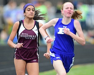 POLAND, OHIO - APRIl 25, 2015: Nadine Gabriel Boardman jogs behind Emily Ethridge of Poland during the girls 1600 meter run Saturday afternoon at Poland High School during the  Poland Invitational Track & Field Meet. (Photo by David Dermer/Youngstown Vindicator)
