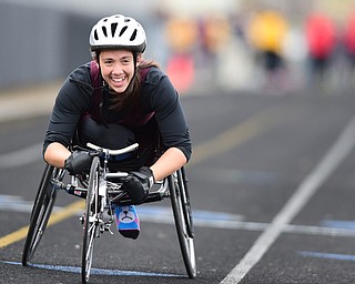 POLAND, OHIO - APRIl 25, 2015: Jenna Fesemyer of Southeast smiles after crossing the finish line during the Mixed 402 Meter Run Wheelchair race Saturday afternoon at Poland High School during the Poland Invitational Track & Field Meet. (Photo by David Dermer/Youngstown Vindicator)