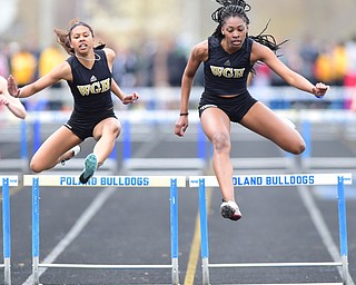 POLAND, OHIO - APRIl 25, 2015: Aisha Jackson (right) & Gariana Bercheni (left) clear hurdles during the Girls 300 Meter Hurdles finals Saturday afternoon at Poland High School during the Poland Invitational Track & Field Meet. (Photo by David Dermer/Youngstown Vindicator)