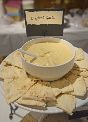 Katie Rickman | The Vindicator.A freshly refilled plate of pita bread and original garlic hummus from Ghossain's Gourmet Mediterranean Foods at the Memorable Meals Mahoning Valley at the Stambaugh Auditorium on April 26, 2015.