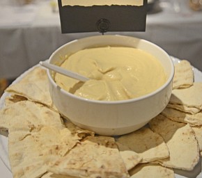 Katie Rickman | The Vindicator.A freshly refilled plate of pita bread and original garlic hummus from Ghossain's Gourmet Mediterranean Foods at the Memorable Meals Mahoning Valley at the Stambaugh Auditorium on April 26, 2015.