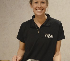 Katie Rickman | The Vindicator.Taylor Gapczynski (OKAY) a server at MVR smiles as she prepares to serve their Tressel Tortellini which was one of their featured dishes  at the Stambaugh Auditorium on April 26, 2015.