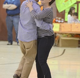 Katie Rickman | The Vindicator.John Koszar dances the "Fly Me To The Moon" by Frank Sinatra with his wife Melissa  during a benefit for Robert J. Melone at St. Charles Hall in Boardman on April 26, 2015.