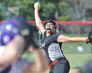 Jeff Lange | The Vindicator  APRIL 29, 2015 - Canfield winning pitcher Allison Fabry winds up a pitch for a Champion batter in the early innings of the Cards' softball game, Wednesday night in Canfield.