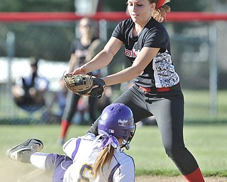 Jeff Lange | The Vindicator  APRIL 29, 2015 - Champion base runner Brittany Allen slides beats the tag of Canfield's second baseman Carly Trefethern in the top of the fourth inning, Wednesday night in Canfield.