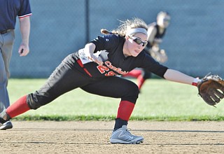 Jeff Lange | The Vindicator  APRIL 29, 2015 - Canfield shortstop Rachel Tinkey dives for a ground ball sent up the middle in the top of the fifth inning of the Cards' softball game against Champion, Wednesday night in Canfield.