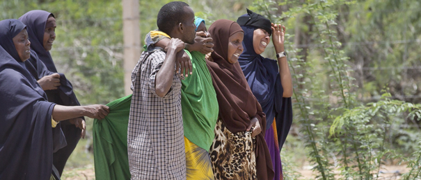 Unidentified relatives grieve as they walk towards a center set up for relatives and survivors in Garissa, Kenya, Friday, April 3, 2015. Al-Shabab gunmen rampaged through a university in northeastern Kenya at dawn Thursday, killing scores of people in the group's deadliest attack in the East African country. Four militants were slain by security forces to end the siege just after dusk. (AP Photo/Ben Curtis)