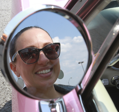 William D. Lewis The Vindicator  Lucia Martuccio of Girard shows off her 1966 pink Mustang. she is a member of Mahoning ValleyMustangs. Her father restored the car for her. Event Sunday at Quaker Steak and Lube in Austintown.