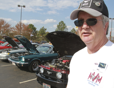 William D. Lewis the Vindicator  Robert Macabobby of Canfield and member of Mahoning Valley Mustangs car club at Sunday car show. He says" When you drive an old Mustang its like a one car parade"