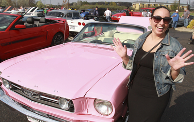 William D. Lewis The Vindicator  Lucia Martuccio of Girard shows off her 1966 pink Mustang. she is a member of Mahoning ValleyMustangs. Her father restored the car for her. Event Sunday at Quaker Steak and Lube in Austintown.