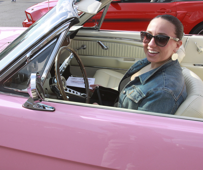 William D. Lewis The Vindicator  Lucia Martuccio of Girard shows off her 1966 pink Mustang. she is a member of Mahoning ValleyMustangs. Her father restored the car for her. Event Sunday at Quaker Steak and Lube in Austintown.
