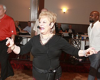 William d Lewis the Vindicator Dance instructor Teresa Flora leads a classin salsa dancing at Kuzman's in girard 5-3-15.