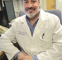 Katie Rickman | The Vindicator.Dr. Marc Saunders DO poses for a photo at St. Joseph's in Warren on May 5, 2015. Dr. Saunders is one of the doctors who used the Dragon medical device that records his notes as he speaks to the device.