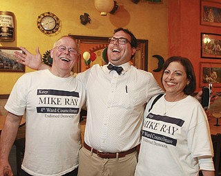 William D Lewis the Vindicator  Mike Ray, 4th ward Youngstown c-man, celebrates at Casa Ramirez with his dad Mike Ray Sr and mom Rocky Ray after wining election.