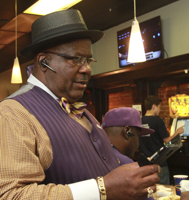 William D Lewis the Vindicator  Mike Write 1rst ward Youngstown c-man, checks results at Avalon Downtown election night.