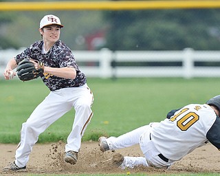 Jeff Lange | The Vindicator  MAY 6, 2015 - South Range second baseman Jack Bajerski (left) looks to make the throw to first after stepping on the bag over Crestview's Jacob Wick in the top of the second inning of their game, Wednesday night at South Range High School.