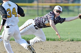 Jeff Lange | The Vindicator  MAY 6, 2015 - South Range second baseman Jack Bajerski (right) dives for the ball as Crestview base runner Daniel Moore advances to second in the top of the seventh inning at South Range High School.