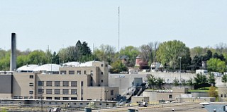 Jeff Lange | The Vindicator  MAY 4, 2015 - A line of emergency vehicles formed on Gibson Street as hazmat crews worked to control a chlorine leak at the waste water treatment plant in Youngstown, Monday morning.