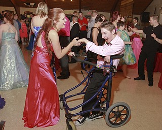 William D. Lewis The Vindicator Dancing at special needs prom 5-8-15 are special needs prom guest Kevin Gandee of West Branch and Makayla Manns, a West Branch HS senior who was helping out at the event. Prom was held at St. Mary's in Youngstown.