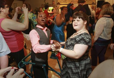 William D. Lewis The Vindicator Dancing at special needs prom 5-8-15 are special needs prom guests George Washington of East HS and Destiny Pratter of Campbell HS.. Prom was held at St. Mary's in Youngstown.