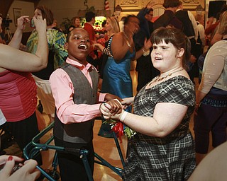 William D. Lewis The Vindicator Dancing at special needs prom 5-8-15 are special needs prom guests George Washington of East HS and Destiny Pratter of Campbell HS.. Prom was held at St. Mary's in Youngstown.