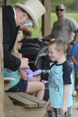 Katie Rickman | The Vindicator.Judson Weingart 6 of Damascus laughs as Mikey D Mamaluke the clown wrote "Judson" on a baloon animal at the 5th annual Carnival  at Damascus Elementary School on May 9, 2015.